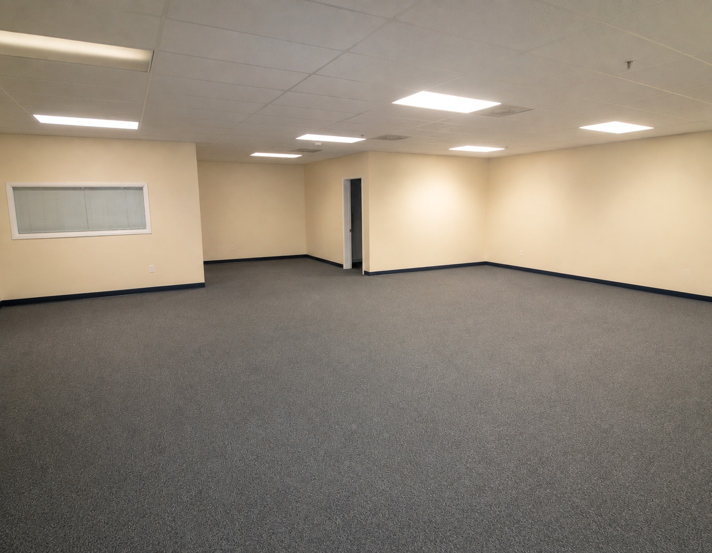 The same office suite emptied and vacuumed, ready for the next tenant